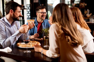 young-people-having-dinner-in-the-restaurant-400-237764939